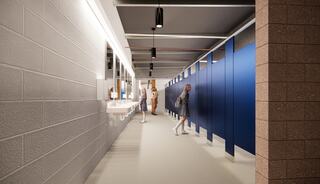 A modern restroom layout featuring blue partitions, sinks, and illuminated mirrors, with individuals engaged in various activities inside.