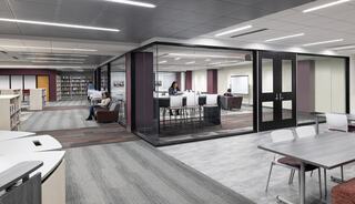 A modern, open space featuring a library area, glass-walled meeting rooms, and various seating arrangements for collaborative work.