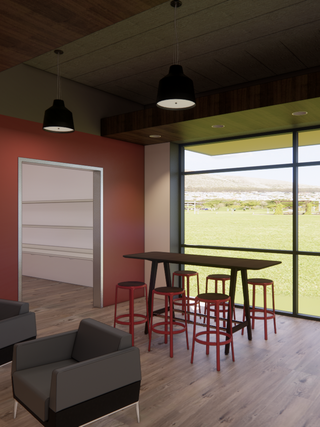 A modern lounge area features a high table with red stools, black chairs, and a large window overlooking greenery. Simple and spacious design.