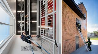 Firefighters train in a facility featuring climbing drills and exterior ladders, emphasizing skill development and teamwork in emergency scenarios.