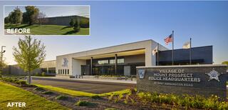 Exterior facade of Village of Mount Prospect Police Headquarters at dusk with three flags waving out front, with an inset photo of the before view of a blank former manufacturing/warehouse facility.