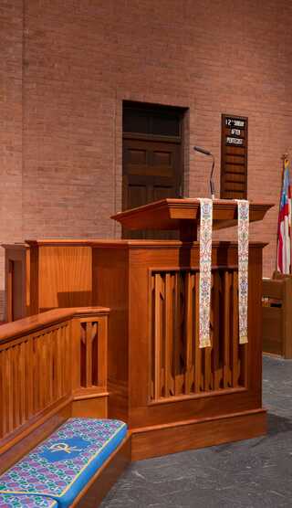 A serene church interior with warm brick walls.