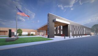 FGMA's exterior rendering of Staunton School District's Renovated High School features a large entrance, surrounded by greenery and an American flag, showcasing a sleek architectural design.