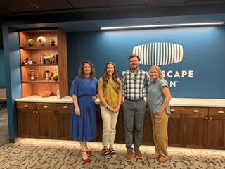The FGM Architects project team poses in the new Center for Immersive Learning at St. Charles Community College, in the explorer's lounge that leads to the innovative VR labs run by project partner Dreamscape Learn.