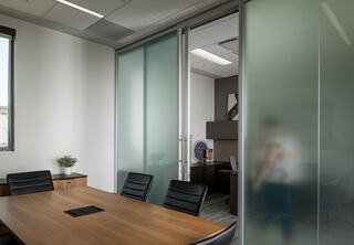 Transparent film on office doors provides privacy while allowing natural light to pass through