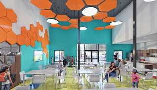 A vibrant gathering space features teal walls, hexagon ceiling decor in orange, bright yellow floors, and modern furniture, filled with people.