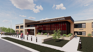 A modern middle school features a welcoming entrance, greenery, and students gathered outside, under a clear blue sky.