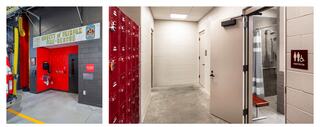 A vibrant fire rescue station entrance from within the apparatus bays, with lockers and restrooms nearby, featuring modern design and facilities for firefighters.