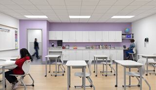 A modern classroom featuring desks, a book storage area, and two students engaged in different activities, with a calming purple backdrop.