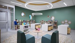A cozy reading space features green walls, circular light fixtures, bookshelves, and playful seating, inviting children to explore and read.