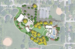 Aerial layout of a park featuring buildings, green spaces, parking areas, and a swimming pool, surrounded by trees and pathways.