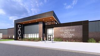 A modern vocational center with a sleek design features large windows and brick accents, welcoming students and visitors to its entrance.
