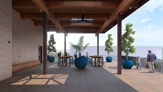 A spacious outdoor area features large potted plants and tables underneath a wooden roof, with people engaged in conversation and relaxation.