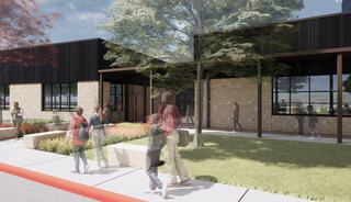 A modern building with stone accents features lush landscaping. Children walk along a pathway, engaging with their surroundings.