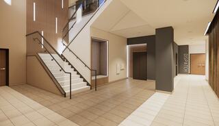 A modern interior features a staircase, elevator, and dispatch area, with sleek design and neutral colors creating a spacious atmosphere.