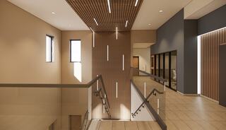A modern, spacious interior featuring sleek wood accents, natural light, and minimalist design elements in a well-lit hallway.