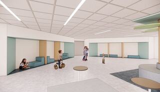 A modern, open space with children playing and interacting. Soft colors and seating areas foster a playful, welcoming environment.