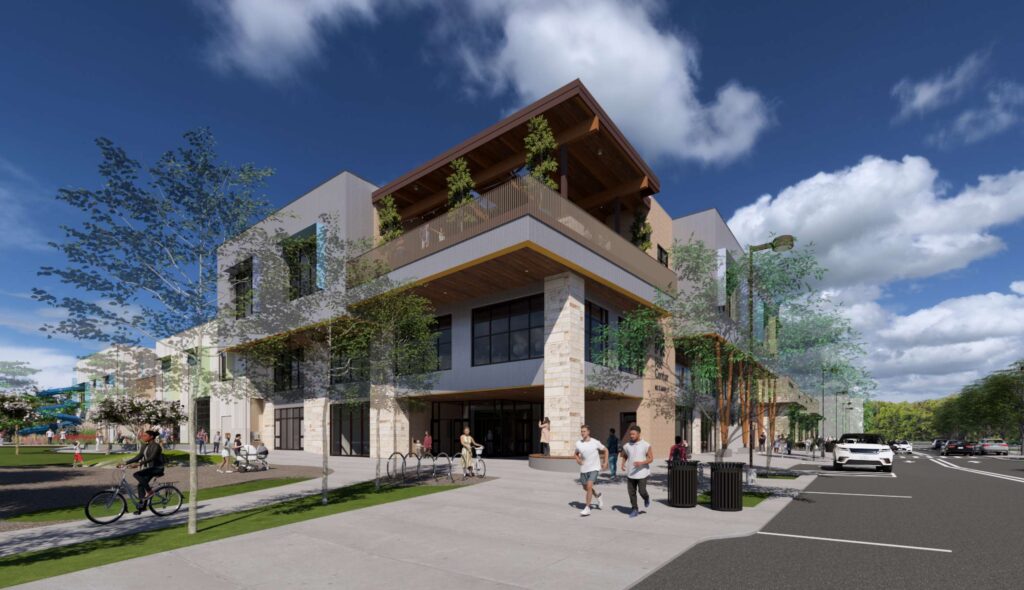A modern, multi-story recreation center featuring large windows, a rooftop terrace, landscaped grounds, and people walking nearby under a clear blue sky.