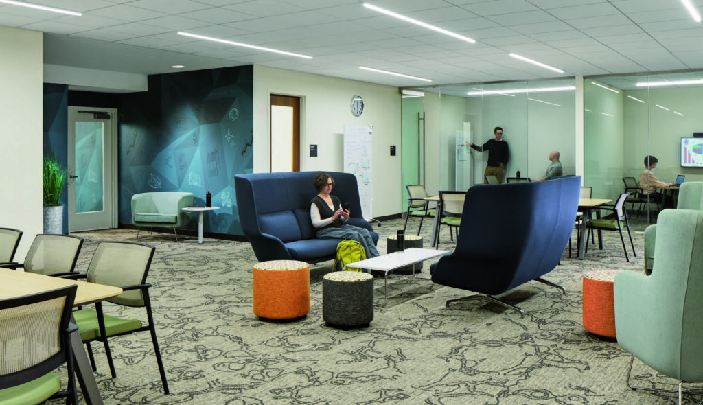 A modern lounge space with colorful furniture, featuring cozy seating areas, a workspace, and glass walls, creating an inviting atmosphere.