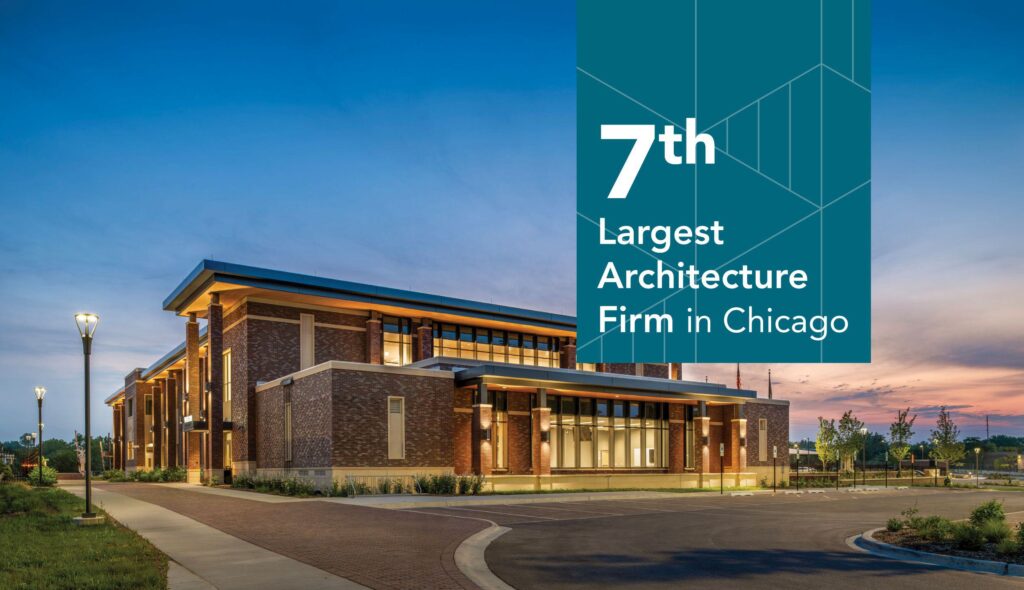 Downers Grove Civic Center, designed by FGM Architects, photographed at dusk with dark blue skies and pink and yellow clouds.