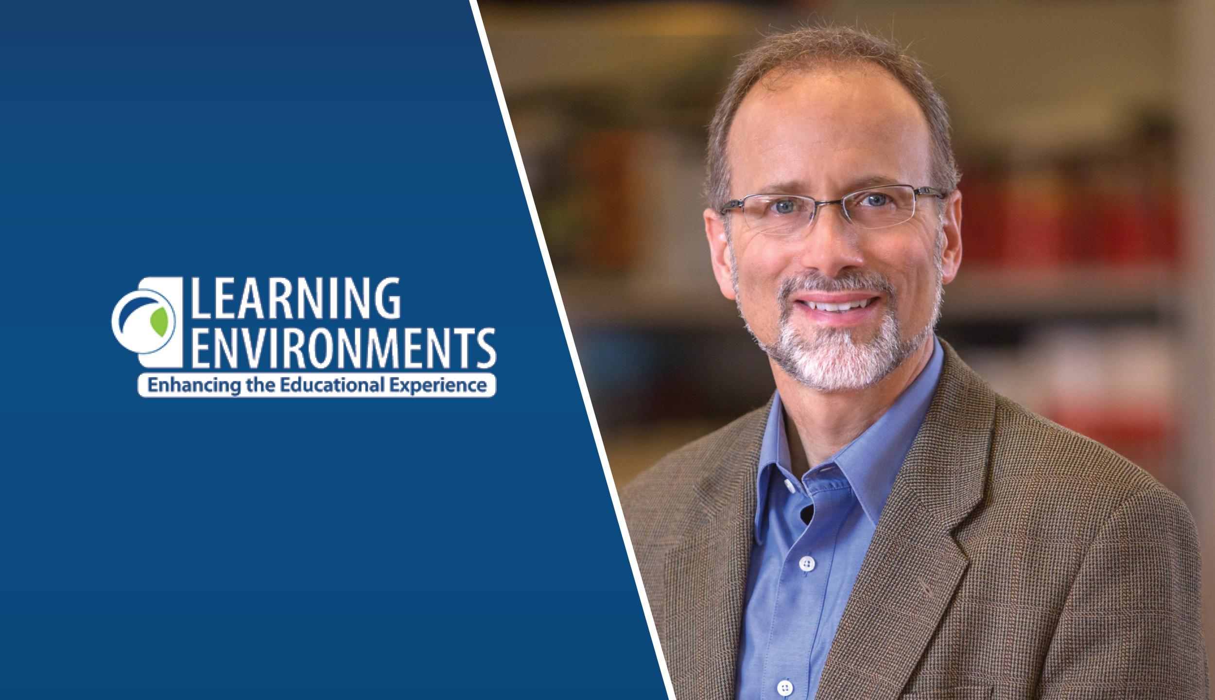 A smiling man in professional attire stands beside a logo promoting educational enhancement through learning environments.